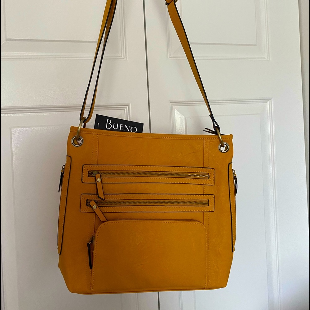 NWT marigold handbag with lots of compartments.